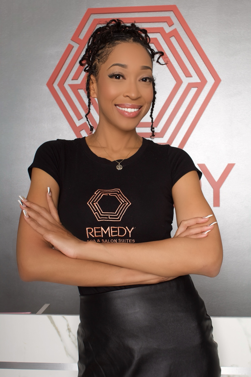 Business owner photographed in front of her own brand backdrop by Ki Shot It Visuals