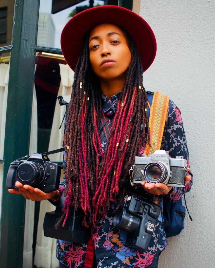 Shakita Ki Alford holding her cameras